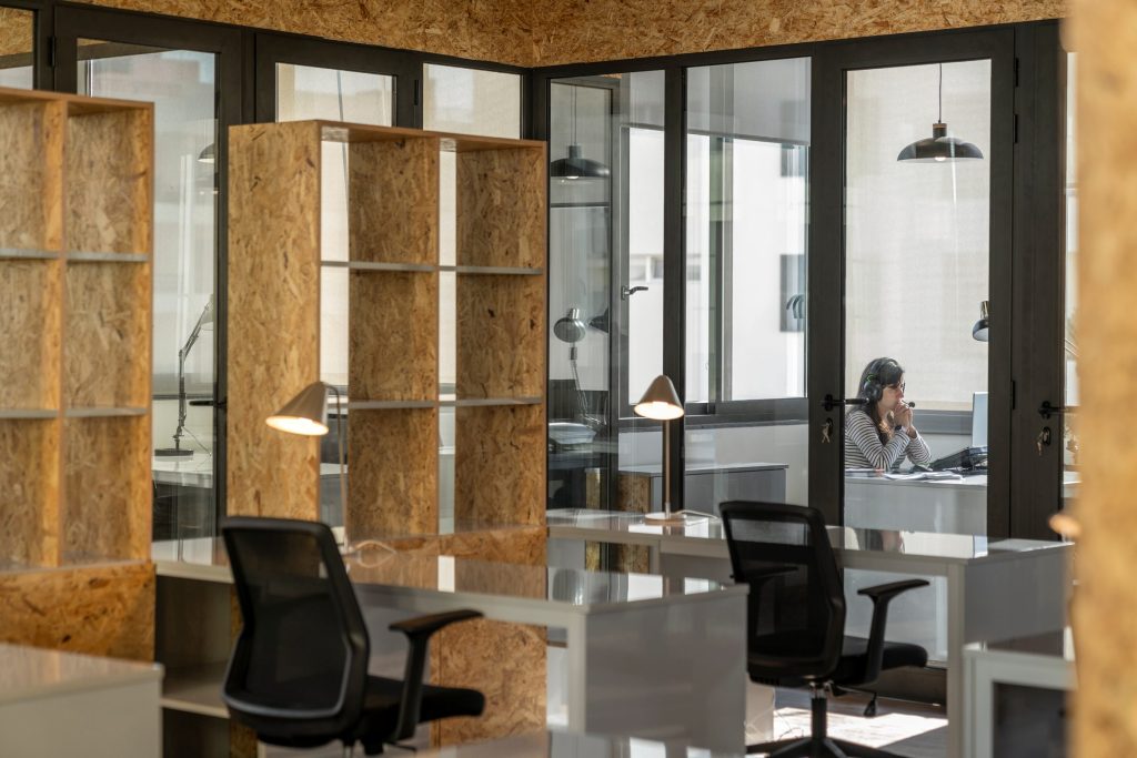 Glass-walled private offices at Sangha Cowork, Funchal