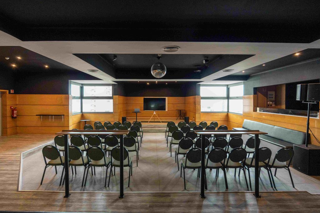 Multipurpose event room set up theatre-style with rows of chairs, Dorisol Hotels, Funchal